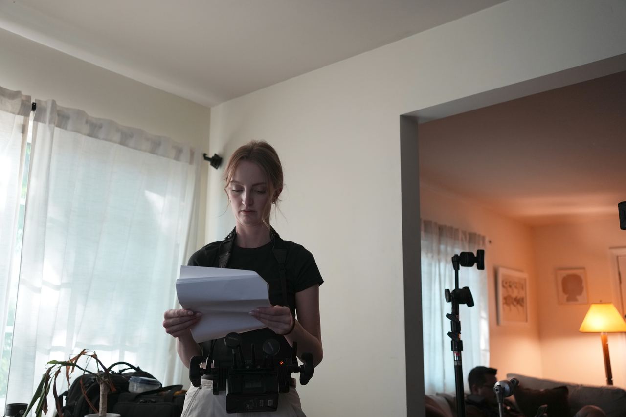 Chelsey Kaye reading the script on the set of Still Here