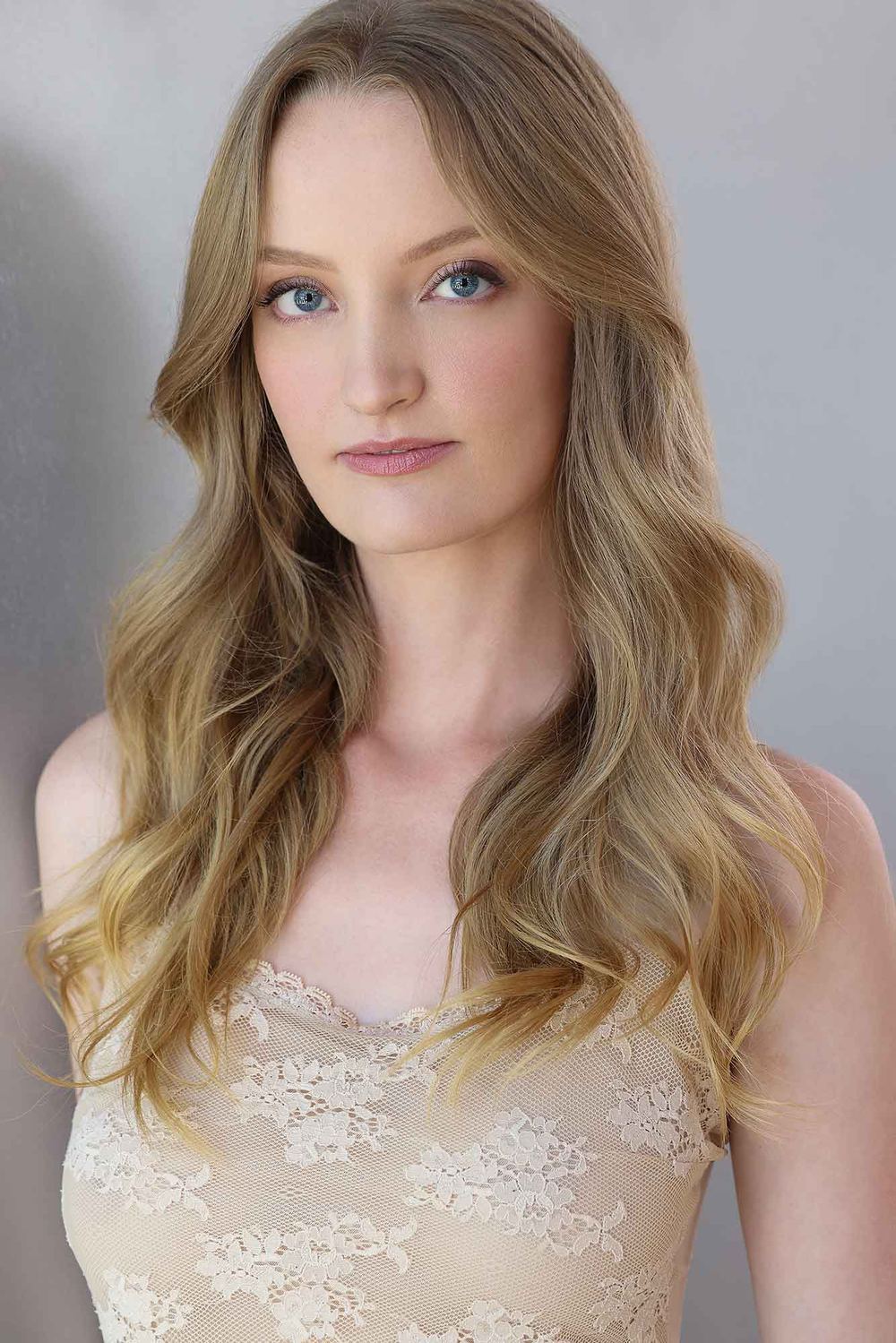 Chelsey Kaye headshot in a cream lace top