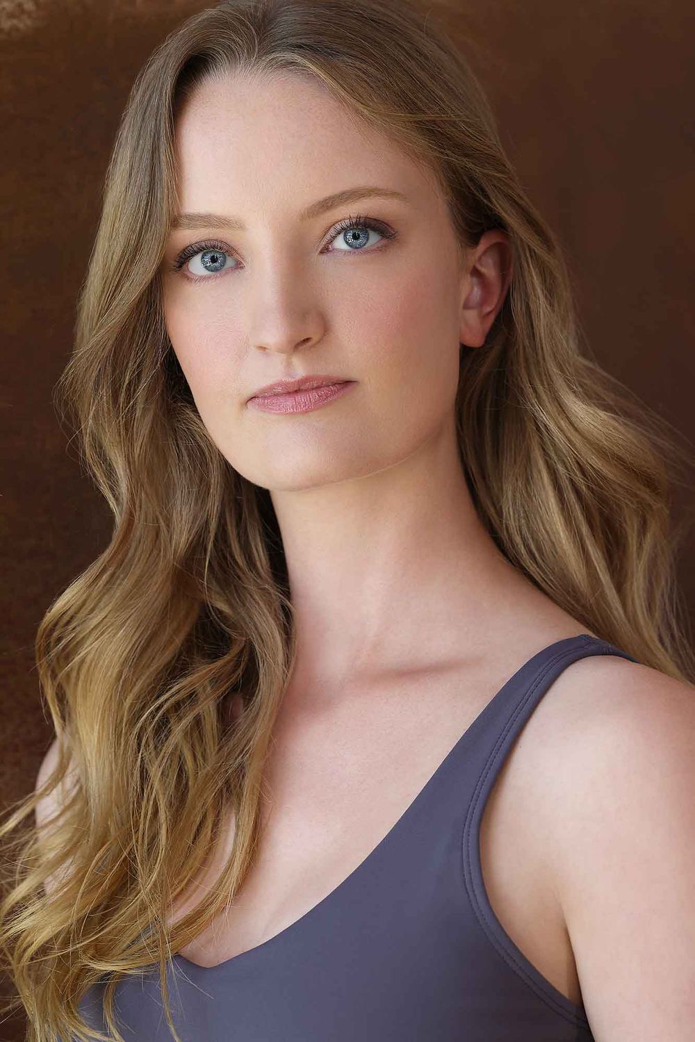 Chelsey Kaye headshot in a grey tank top